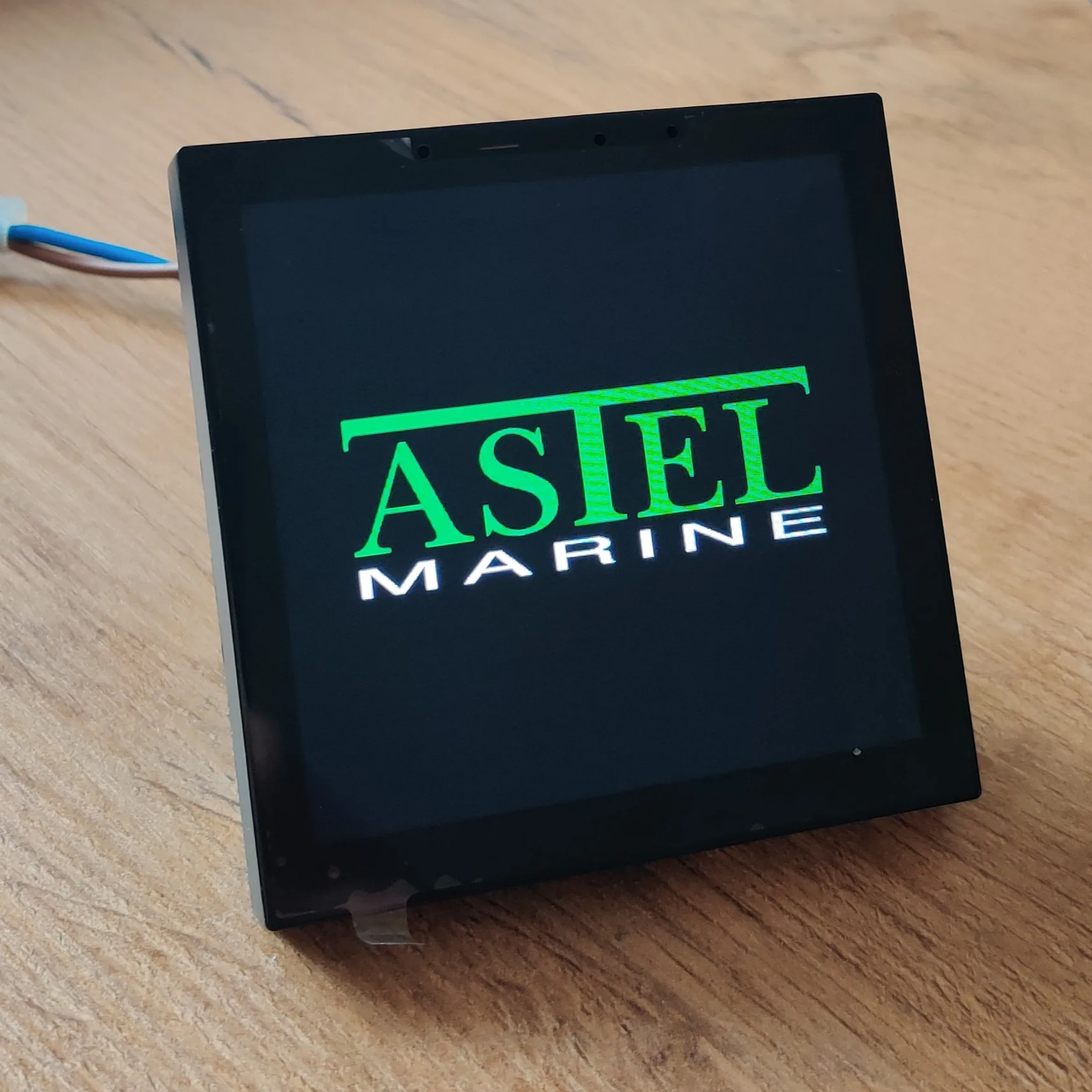 ASTEL touchscreen kiosk displaying the ASTEL Marine boot logo